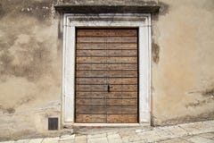 Old wooden door in rural italian house, Tuscany, Italy. stock photo Old wooden door in rural italian house, Tuscany, Italy. stock photo