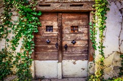 Old Wooden Textured Door And Weathered Wall Royalty Free Stock Images