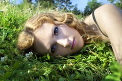 On The Nature Of The Beautiful Girl In The Grass Stock Images