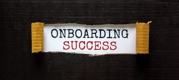 Onboarding success symbol. Words `Onboarding success` appearing behind torn black paper. Beautiful black background. Business,