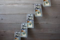 A one hundred dollars bills on wooden background royalty free stock image A one hundred dollars bills on wooden background royalty free stock image