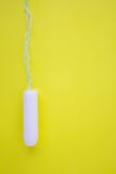 One swab with cotton on a yellow background. The concept of the period of the menstrual cycle. Top view, flat lay. royalty free stock photos One swab with cotton on a yellow background. The concept of the period of the menstrual cycle. Top view, flat lay. royalty free stock photos