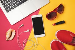 Online booking for summer vacation holiday concept. Smartphone, laptop computer and beach items. View from above. royalty free stock photos Online booking for summer vacation holiday concept. Smartphone, laptop computer and beach items. View from above. royalty free stock photos