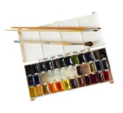 Open box with watercolor paints and brushes stock images Open box with watercolor paints and brushes stock images