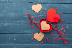 Open heart shape gift box with cookies over wooden background. royalty free stock photo Open heart shape gift box with cookies over wooden background. royalty free stock photo