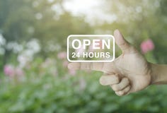 Open 24 hours icon on finger stock photography Open 24 hours icon on finger stock photography