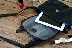 Open leather bag with women cosmetics stock photography Open leather bag with women cosmetics stock photography