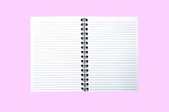 Opened notebook with a strip on a spring isolated on a pink background. royalty free stock photography Opened notebook with a strip on a spring isolated on a pink background. royalty free stock photography