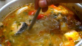 Opening lid of pan, boiling soup Of salmon, Soup