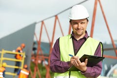 Operaio del gestore di luogo del costruttore al cantiere Immagini Stock Libere da Diritti Operaio del gestore di luogo del costruttore al cantiere Immagini Stock Libere da Diritti