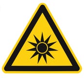 Optical radiation hazard caution safety danger warning text sign sticker label, artificial light beam icon symbol, isolated black vector illustration Optical radiation hazard caution safety danger warning text sign sticker label, artificial light beam icon symbol, isolated black vector illustration