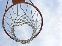 An orange basketball hoop. Against a blue sky Royalty Free Stock Images An orange basketball hoop. Against a blue sky Royalty Free Stock Images