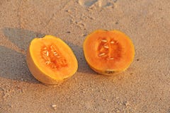 Orange cut melon with seeds inside. Two halves of a beautiful me royalty free stock image Orange cut melon with seeds inside. Two halves of a beautiful me royalty free stock image