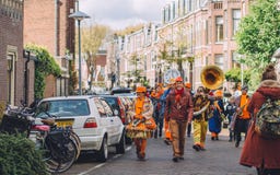 Orange dutch band during King`s Day festivity, street festival