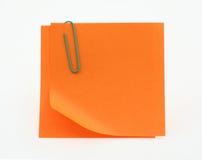 Orange post-it notes with a bent corner on white