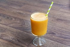 Orange smoothie with apple , kiwi and carrots. Healthy life concept. stock photo Orange smoothie with apple , kiwi and carrots. Healthy life concept. stock photo