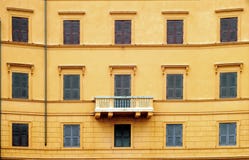 Orange wall with windows and balcony