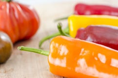orange, yellow and red bell pepper and costoluto genovese tomato royalty free stock photography orange, yellow and red bell pepper and costoluto genovese tomato royalty free stock photography