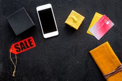 Order new year 2018 present with sale with credit card and mobile on black table background top view mock up Royalty Free Stock Photo Order new year 2018 present with sale with credit card and mobile on black table background top view mock up Royalty Free Stock Photo
