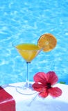 Orenge Juice By The Pool Royalty Free Stock Photo