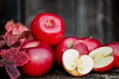 Organic fresh apples on wooden background in autum