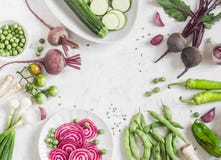 Organic purple and green vegetables on a white background. Detox ingredients. Healthy, vegetarian food concept. Top view, free spa