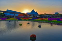 Journey into imagination attraction, monorail road, colorful figures of mickey with flowers and lake on beautiful sunset backgroun stock image Journey into imagination attraction, monorail road, colorful figures of mickey with flowers and lake on beautiful sunset backgroun stock image