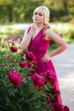 Outdoor close up portrait of beautiful young woman in the blooming garden. Female spring fashion concept stock photo Outdoor close up portrait of beautiful young woman in the blooming garden. Female spring fashion concept stock photo