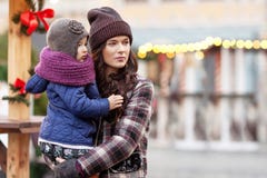 Outdoor Close Up Portrait Of Young Woman And Little Girl In Christmas Decorations On Street Of  City. Happy Family With Little Royalty Free Stock Photography