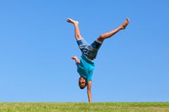 Outdoor portrait of a cute teenage black boy jumping stock photos Outdoor portrait of a cute teenage black boy jumping stock photos