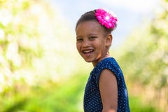 Outdoor portrait of a cute young black girl smiling - African pe Stock Photography Outdoor portrait of a cute young black girl smiling - African pe Stock Photography
