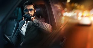 Outdoor portrait of fashion man driving a car stock image Outdoor portrait of fashion man driving a car stock image