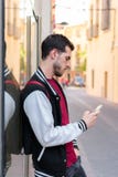 Outdoor portrait of modern young man with mobile phone stock photography Outdoor portrait of modern young man with mobile phone stock photography