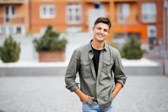 Outdoor Portrait Of Handsome Young Man Walking On The Street, Looking At Camera And Smile Stock Images