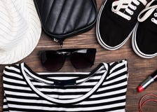Outfit of modern young girl on the wooden background royalty free stock images Outfit of modern young girl on the wooden background royalty free stock images