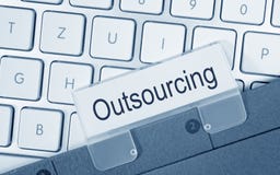 Outsourcing folder on computer keyboard Royalty Free Stock Photos Outsourcing folder on computer keyboard Royalty Free Stock Photos
