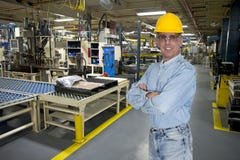 Ouvrier industriel de sourire de fabrication photo libre de droits Ouvrier industriel de sourire de fabrication photo libre de droits