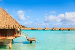 Over water bungalows with steps into amazing green lagoon royalty free stock photos Over water bungalows with steps into amazing green lagoon royalty free stock photos