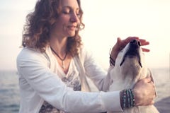 Owner caressing gently her dog royalty free stock photography Owner caressing gently her dog royalty free stock photography