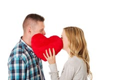 Paare, die hinter dem Kissen flüstern Lizenzfreies Stockbild Paare, die hinter dem Kissen flüstern Lizenzfreies Stockbild