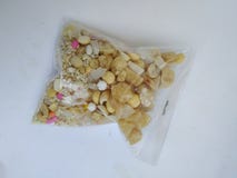Plastic Pack of ellu bella/Jaggery and Sesame Seeds sweet mixture to share during Sankranti or pongal festival in Karnataka