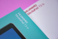Package box of New Tablet huawei mediapad t3 10 inch front HUAWEI logo on pink stock image Package box of New Tablet huawei mediapad t3 10 inch front HUAWEI logo on pink stock image