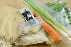Packaged food items in meal delivery kit