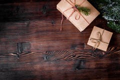 Packaging christmas gifts in boxes on wooden background top view royalty free stock photo Packaging christmas gifts in boxes on wooden background top view royalty free stock photo