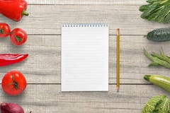 Pad and pencil for writing a vegetarian list of ingredients. Empty paper for text royalty free stock images Pad and pencil for writing a vegetarian list of ingredients. Empty paper for text royalty free stock images