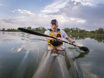 Paddling racing sea kayak Stock Photos Paddling racing sea kayak Stock Photos