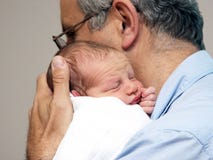 Pai e um bebê Imagem de Stock Pai e um bebê Imagem de Stock