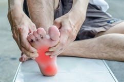 Pain in the foot. Massage of male feet. royalty free stock image Pain in the foot. Massage of male feet. royalty free stock image