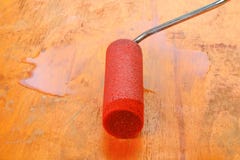 Paint Roll Brush In White Paint On Plywood Surface. Stock Image Paint Roll Brush In White Paint On Plywood Surface. Stock Image