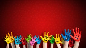 Painted children hands with smiley in front of christmas background Stock Photos Painted children hands with smiley in front of christmas background Stock Photos